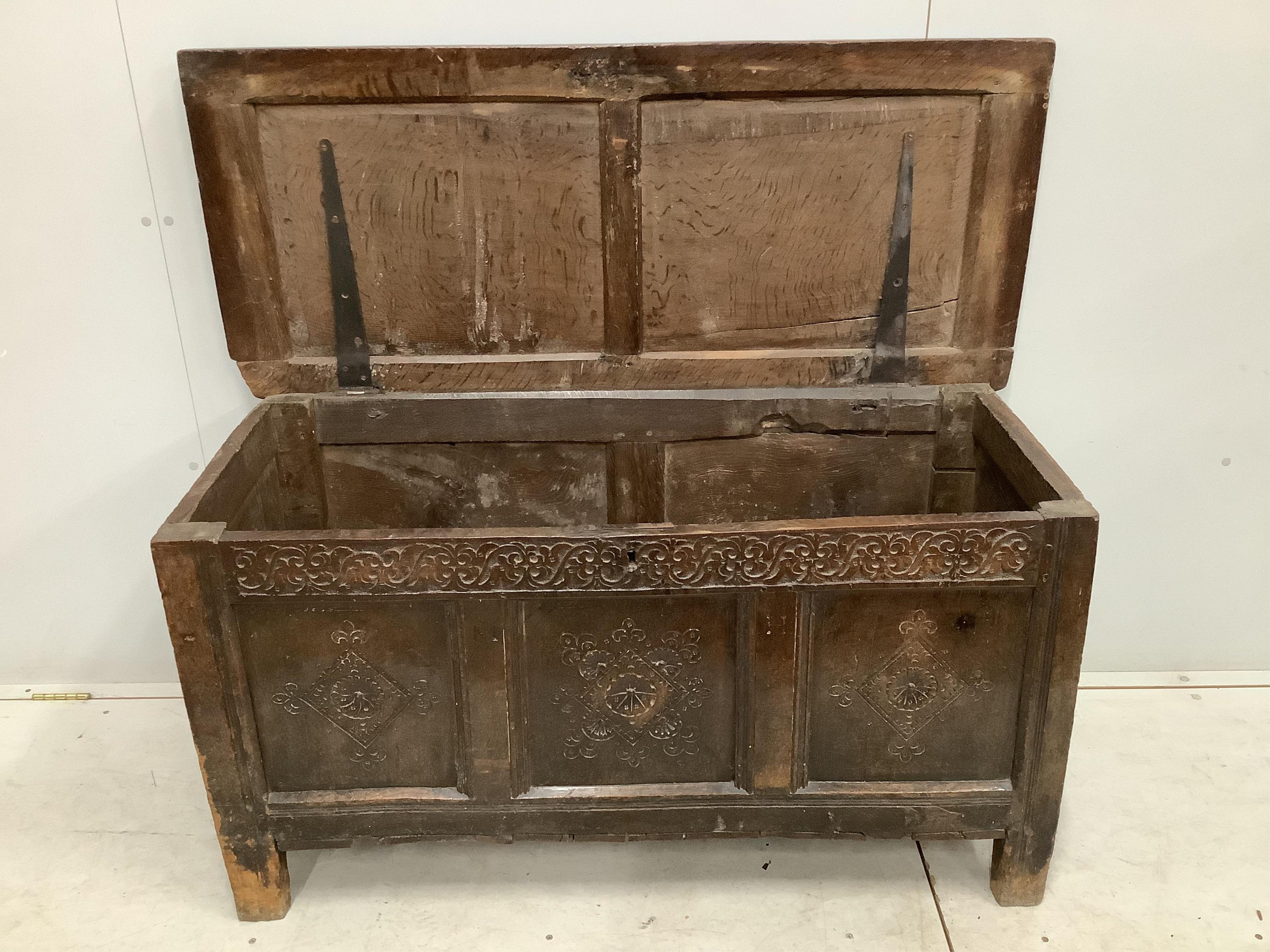 A late 17th century carved oak coffer, width 128cm, depth 56cm, height 66cm. Condition - poor